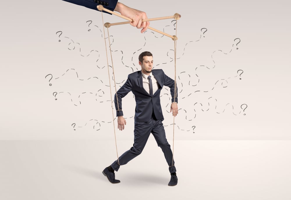 Marionette businessman with doodle lines and arrows around him